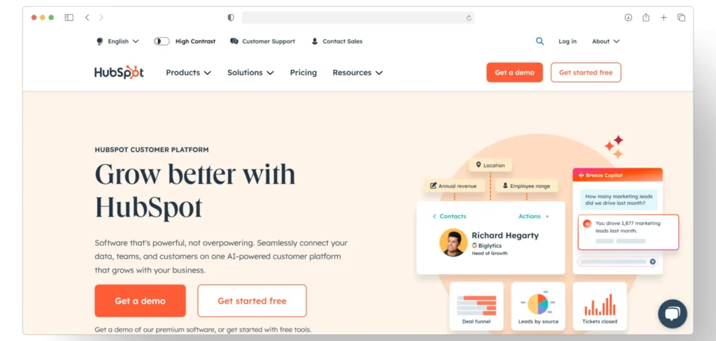 Screenshot of HubSpots homepage featuring the slogan Grow better with HubSpot. Includes navigation links, options for a demo or to get started for free, and illustrations of a dashboard with customer management features.